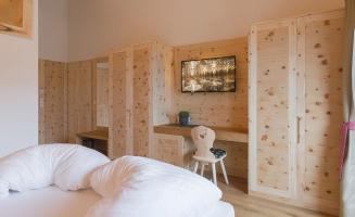 Bedroom with desk and TV