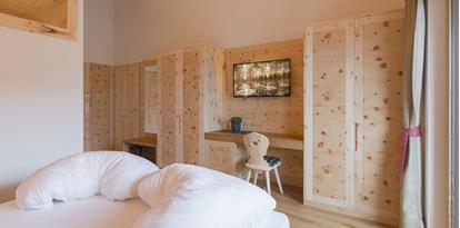 Bedroom with desk and TV