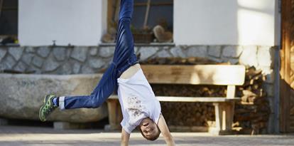 A kid doing a cartwheel